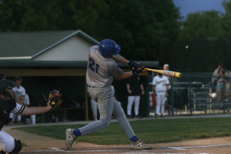 Oshkosh West's Easton Haase swings at a pitch against Oshkosh North at Oshkosh North's E.J. Schneider Field on Tuesday, May 26, 2026. Oshkosh West defeated Oshkosh North, 6-5.