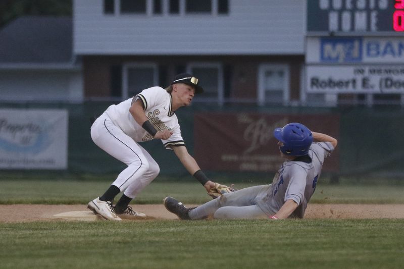 Oshkosh North's Jackson Anderson applies a tag on a Oshkosh West baserunner attempting to steal second base at Oshkosh North's E.J. Schneider Field on Tuesday, May 26, 2026. Oshkosh West defeated Oshkosh North, 6-5.