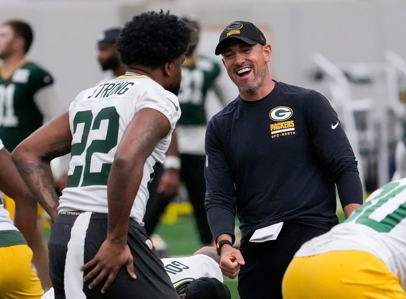 Green Bay Packers head coach Matt LaFleur shares a laugh with running back Pierre Strong Jr. (22) during practice on Wednesday, May 26, 2026, at the Don Hutson Center in Ashwaubenon, Wis. 
Tork Mason/USA TODAY NETWORK-Wisconsin