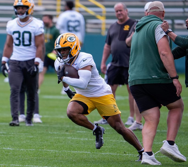 Green Bay Packers running back MarShawn Lloyd runs through a drill during practice on May 26.