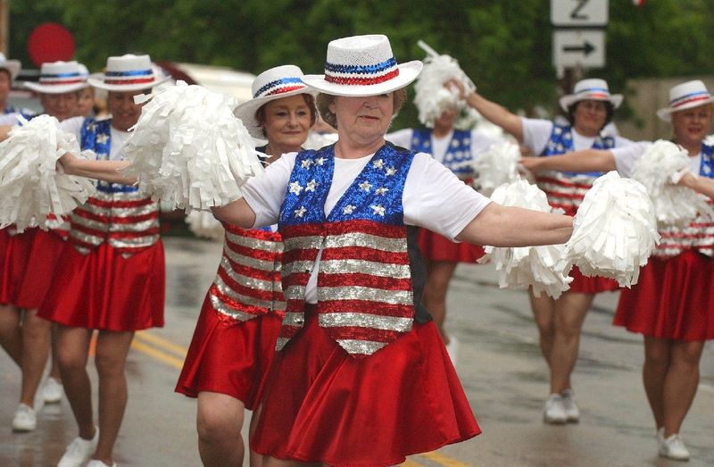 The Milwaukee Dancing Grannies dance their way down Cigrand Drive during the Flag Day Patriotic Parade in Waubeka in 2004.