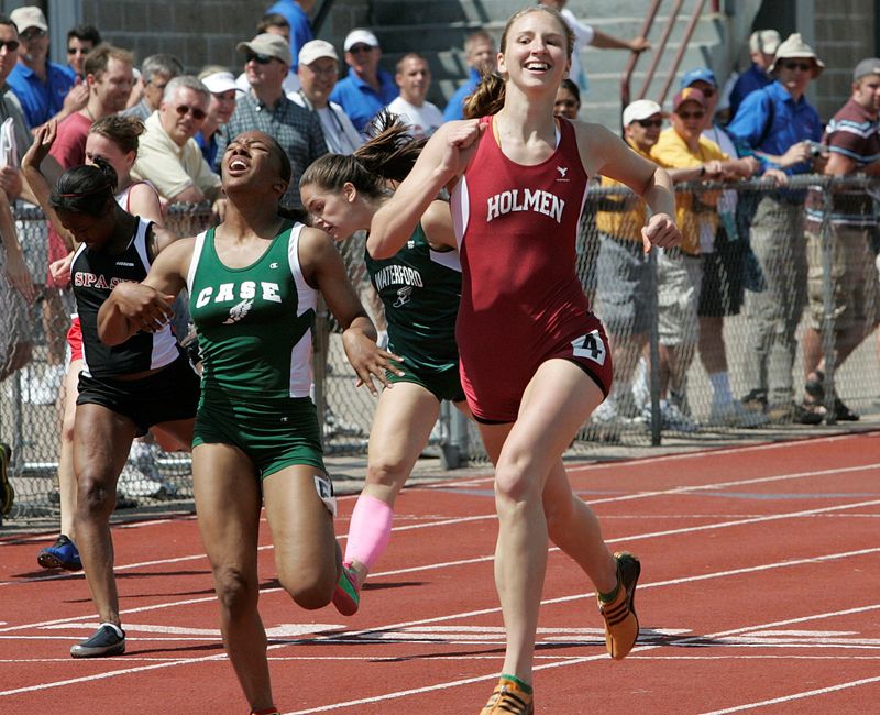 Holmen's Joanna Schultz reacts as she wins her fourth WIAA state track and field title in the 200 meters.