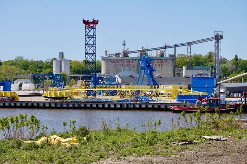 Crane P-82 is shown at the Wisconsin Heavy Fabrication docking area in Manitowoc on Thursday, May 28, 2026. The crane is expected to begin its journey to Joint Base Pearl Harbor-Hickam on Oahu, Hawaii, on Friday, May 29. It will be assisted by the Ocean Tower tugboat.