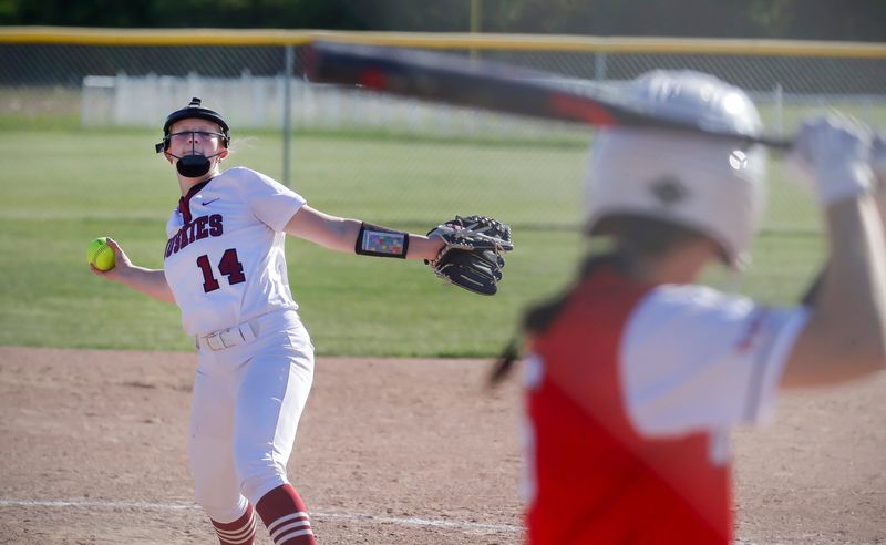 New Holstein’s Reese Kraus (14) winds up a pitch to a Valders player at the WIAA softball regional, Thursday, May 29, 2026, in New Holstein, Wis.