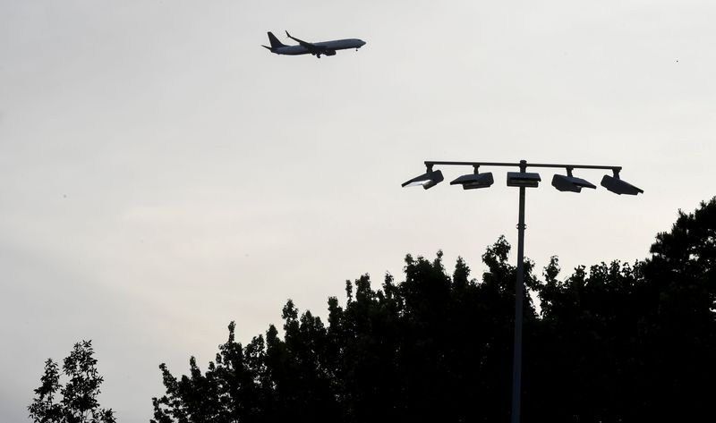 An airplane flies over head Thursday, May 28, 2026 during the SCHSL 3A baseball championship series game between the Southside Christian Sabres and the Oceanside Collegiate Academy Landsharks at Southside Christian School in Simpsonville, South Carolina.