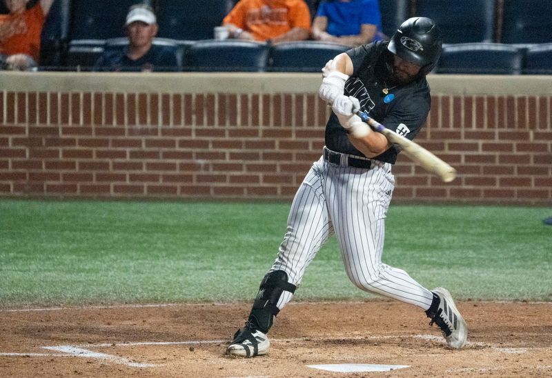 Milwaukee Panthers' Joey Spence (13) swings at the ball as Milwaukee Panthers take on UCF Knights during the NCAA Regional Baseball tournament at Plainsman Park in Auburn, Ala. on Saturday, May 30, 2026.