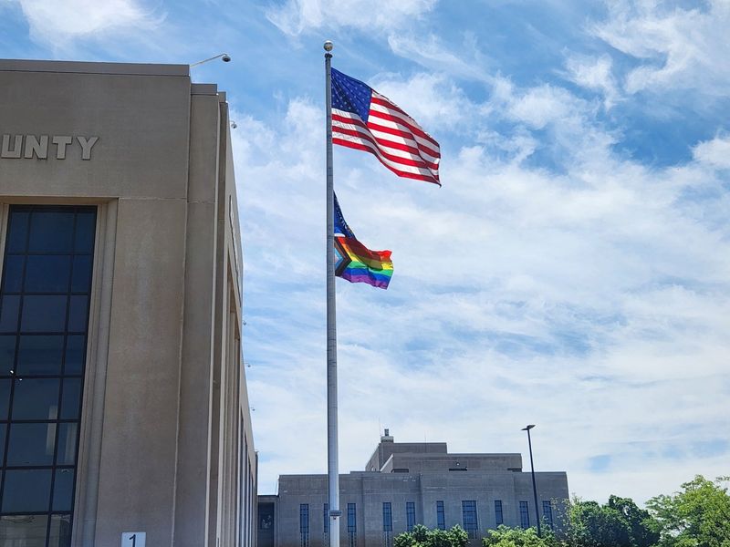 Outagamie County hung up a new Pride flag downtown after an Appleton man allegedly doused the first flag in gasoline on the first day of Pride Month.
