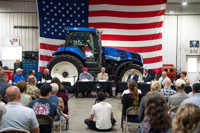 U.S. Rep. Derrick Van Orden and Health and Human Services Secretary Robert F. Kennedy Jr. speak with farmers and faith leaders during a panel at the Gilbertson family farm on the morning of June 1, 2026 in Elk Mound, Wisconsin.