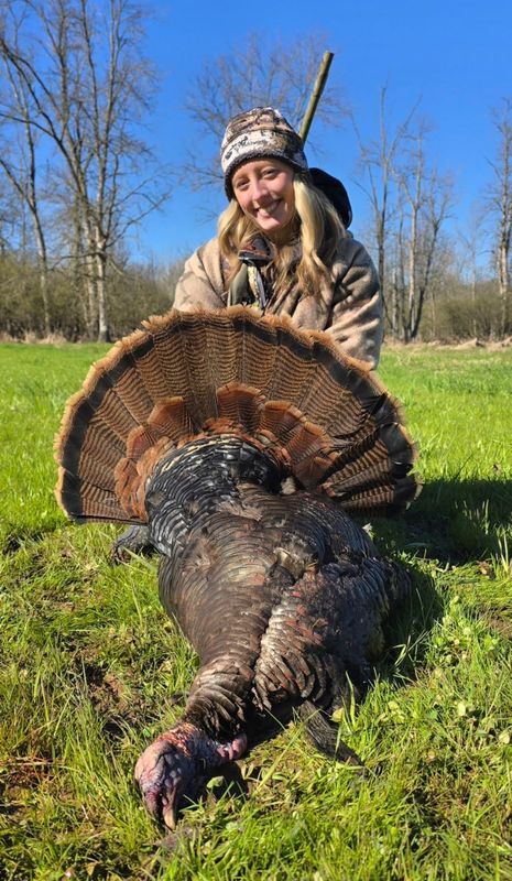 Rylee Fuhrman of Franksville, Wis. poses with the wild turkey she shot while hunting with her father Ryan Fuhrman in Brown County during the third time period of the 2026 Wisconsin spring turkey hunting season.