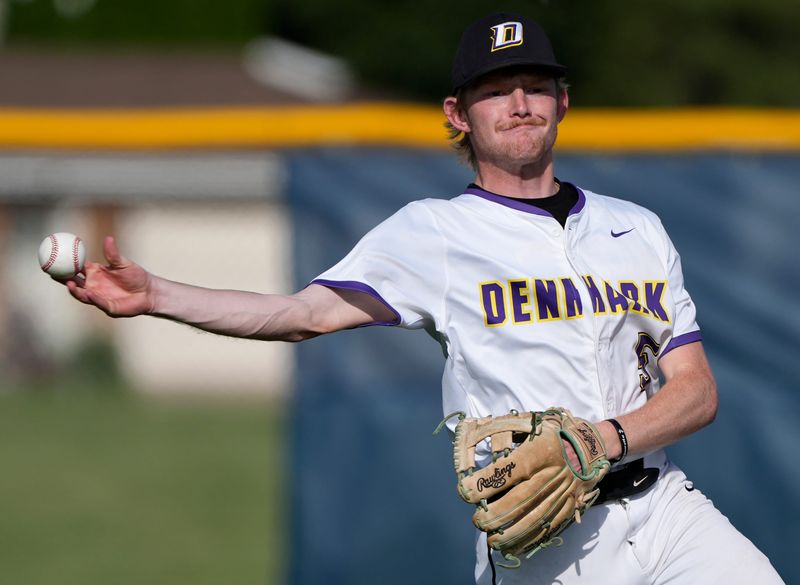Denmark High School's David Dittmer (5) throws to first base against Little Chute High School during their WIAA Division 2 regional final baseball game Wednesday, June 3, 2026, in Little Chute, Wisconsin. Little Chute won 4-2.