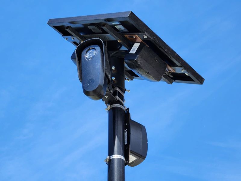 A Flock camera stands near the westbound lane of Wisconsin Avenue June 4, 2026 near Grand Chute, Wi. The town voted to keep license plate readers, but switch the vendor to Axon.