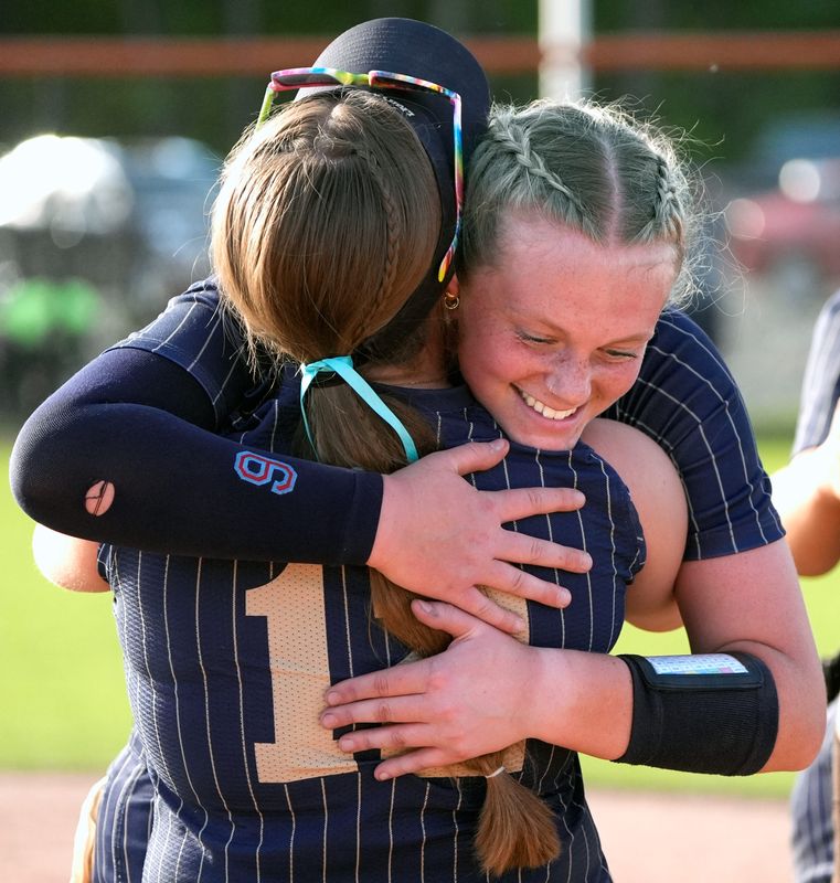 Appleton North High School's Keira Hughes (12) and Charlotte Radtke (9) celebrate their victory against Kimberly High School during their WIAA Division 1 sectional championship softball game Thursday, June 4, 2026, at Kaukauna High School in Kaukauna, Wisconsin. Appleton North won 9-8.
