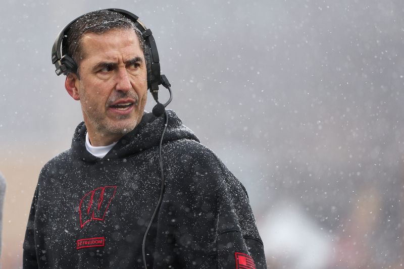 Nov 29, 2025; Minneapolis, Minnesota, USA; Wisconsin Badgers head coach Luke Fickell looks on during the first half against the Minnesota Golden Gophers at Huntington Bank Stadium. Mandatory Credit: Matt Krohn-Imagn Images