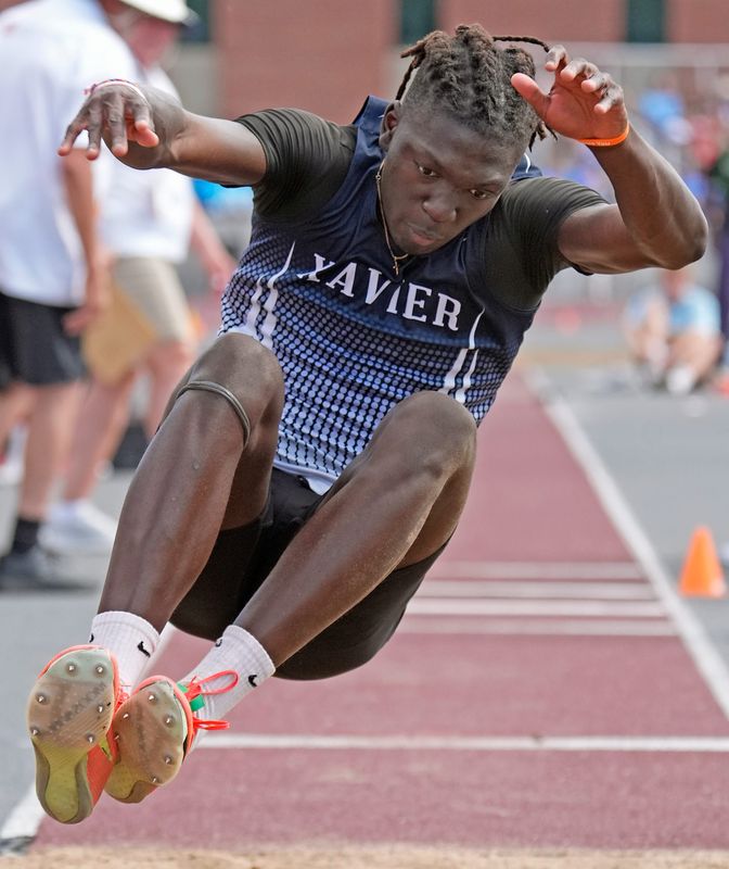 Xavier's Wyatt Rouamba competes in the Division 2 triple jump during the first day of the WIAA state track and field meet June 5 in La Crosse.