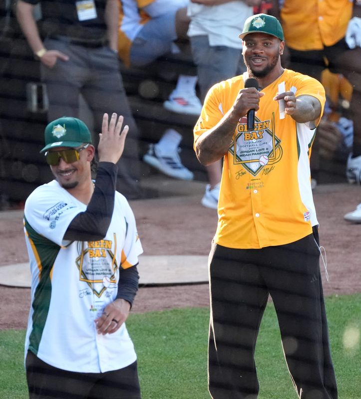 Green Bay Packers Micah Parsons, right, taunts Jordan Love at the start of the Green Bay Charity Softball Game Friday, June 5, 2026, at Neuroscience Group Field at Fox Cities Stadium in Grand Chute, Wisconsin. The event is co-hosted by Green Packers Jordan Love and Micah Parsons.