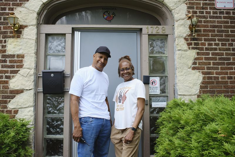 Torre Johnson, founder of Sankofa House (left) and Monica Taylor-Linyard, certified peer specialist and support staff (right), in front of Sankofa House, located at North 18th Street and West Atkinson Avenue on Wednesday, June 10.
