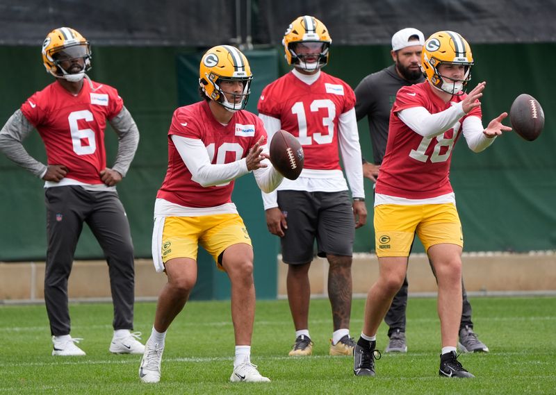 Green Bay Packers quarterbacks Tyrod Taylor (6), Jordan Love (10), Kyron Drones (13) and Kyle McCord (18) participate in mandatory minicamp Thursday, June 11, 2026, at the Don Hutson Center in Green Bay, Wisconsin. 
Dan Powers/USA TODAY NETWORK-Wisconsin