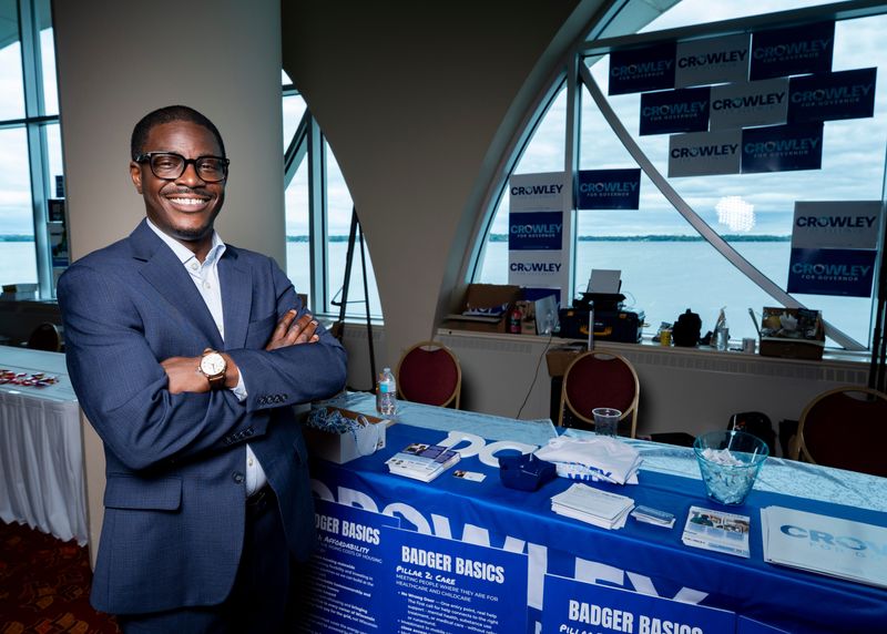 Democratic gubernatorial candidate and Milwaukee County Executive David Crowley stands for a portrait next to his campaign booth during the 2026 Wisconsin Democratic Convention at the Monona Terrace Community and Convention Center in Madison, Wisconsin on June 14, 2026.