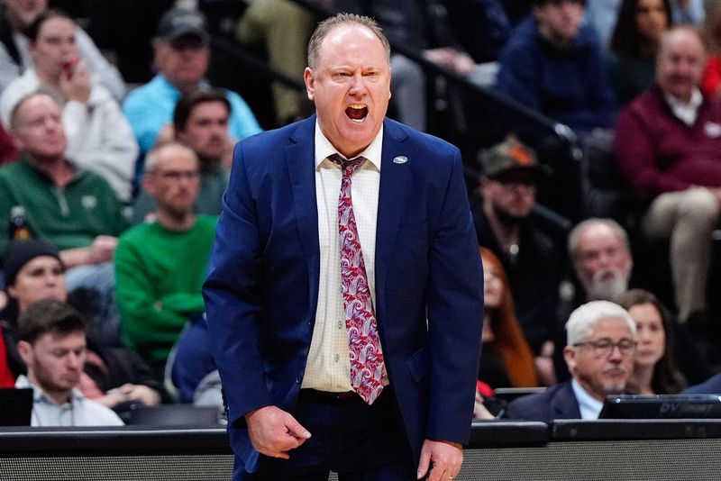 Mar 20, 2025; Denver, CO, USA; Wisconsin Badgers head coach Greg Gard reacts during the second half against the Montana Grizzlies in the first round of the NCAA Tournament at Ball Arena. Mandatory Credit: Ron Chenoy-Imagn Images