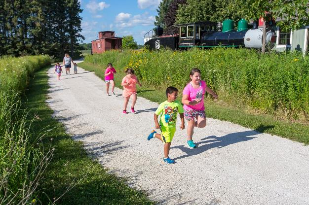 Children playing at Pinecrest Historical Village in Manitowoc.