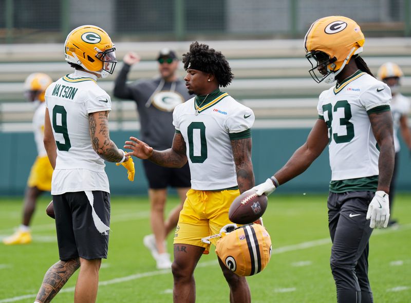 Green Bay Packers wide receiver Christian Watson (9), Green Bay Packers wide receiver Matthew Golden (0), and Green Bay Packers wide receiver Savion Williams (83) prepare to run drills during the first day of a three-day minicamp at the Don Hutson Center in Ashwaubenon, Wisconsin on Tuesday, June 9, 2026.