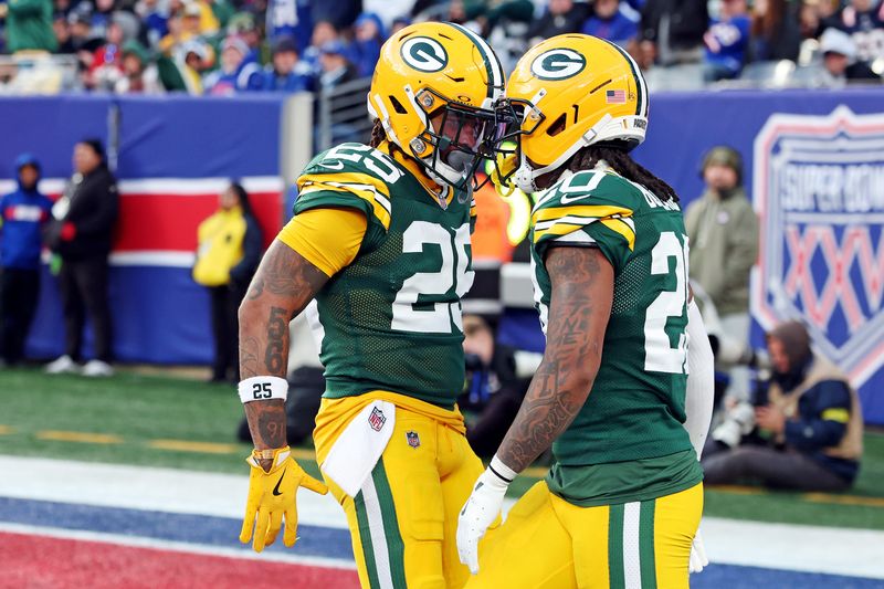Nov 16, 2025; East Rutherford, New Jersey, USA; Green Bay Packers safety Javon Bullard (20) celebrates with cornerback Keisean Nixon (25) after making a play during the fourth quarter against the New York Giants at MetLife Stadium. Mandatory Credit: Vincent Carchietta-Imagn Images