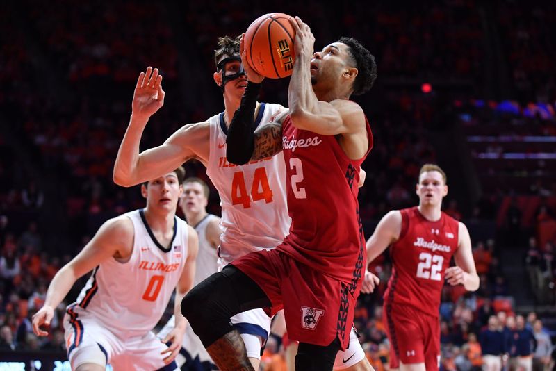 Feb 10, 2026; Champaign, Illinois, USA;  Wisconsin Badgers guard Nick Boyd (2) drives to the basket against Illinois Fighting Illini forward Zvonimir Ivisic (44) during the second half at State Farm Center. Mandatory Credit: Ron Johnson-Imagn Images