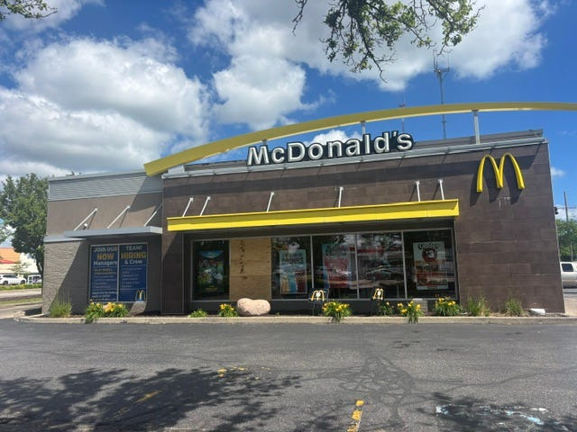 The McDonald's at 420 E. Capitol Drive in Milwaukee had boarded-up doors and windows June 20, 2026, after a nearby shooting that injured four people the previous night.