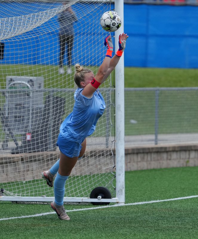 Muskego keeper Savannah Mittelstaedt (1) deflects a penalty shot during the WIAA Division 1 state girls soccer championship game against Divine Savior Holy Angels on Saturday, June 20, 2026, at Uihlein Soccer Park in Milwaukee, Wisconsin.