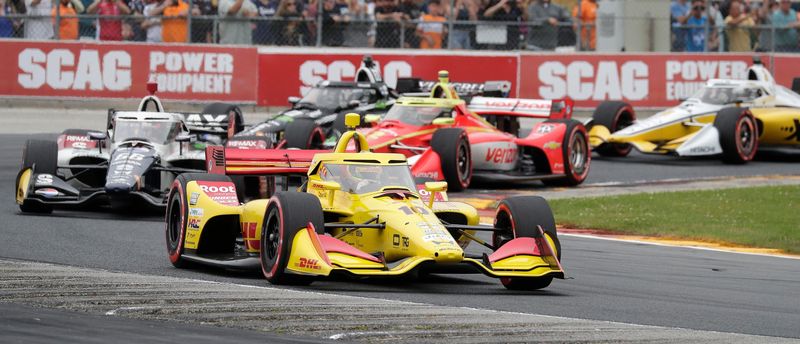 Alex Palou leads the pack through Turn 5 early in the XPEL Grand Prix.