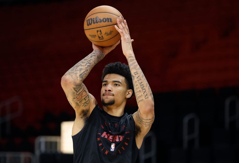 Mar 10, 2025; Miami, Florida, USA;  Miami Heat center Kel'el Ware (7) warms up against the Charlotte Hornets at Kaseya Center. Mandatory Credit: Rhona Wise-Imagn Images