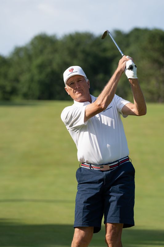 Carl Meyer takes a swing on the course at the Chenequa Country Club.
