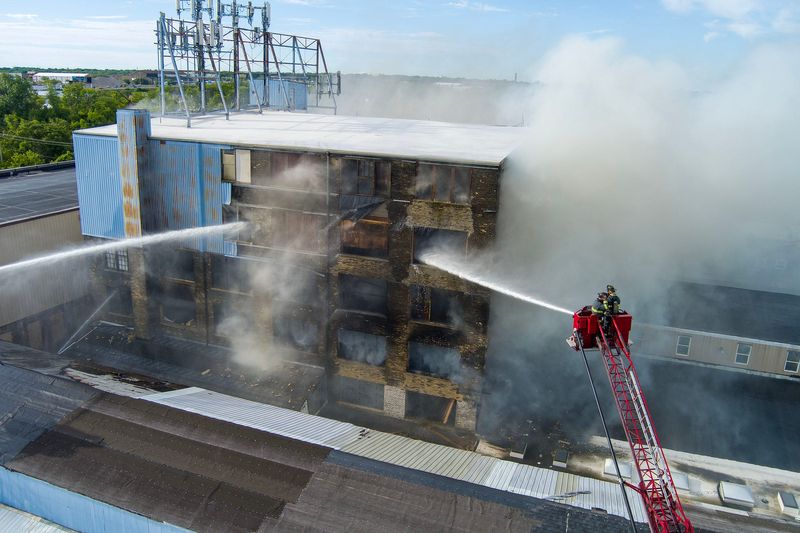 Crews with the Milwaukee Fire Department work to extinguish a fire at a building near the corner of West Cleveland Avenue and South 6th Street in Milwaukee, on June 23, 2026.