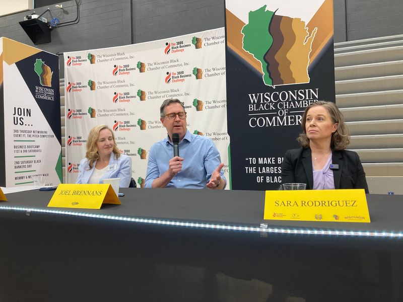 State Sen. Kelda Roys, Joel Brennan president of the Greater Milwaukee Committee, and Lt. Gov. Sara Rodriguez attend a gubernatorial candidates forum hosted by the Wisconsin Black Chamber of Commerce.