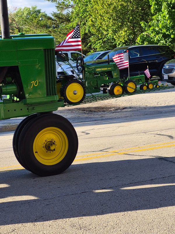 This John Deere 70 was part of the Lambert Brothers' annual John Deere Parade that is held the day before Father’s Day. The platform mounted to the front shows some of the John Deere toys of the past.