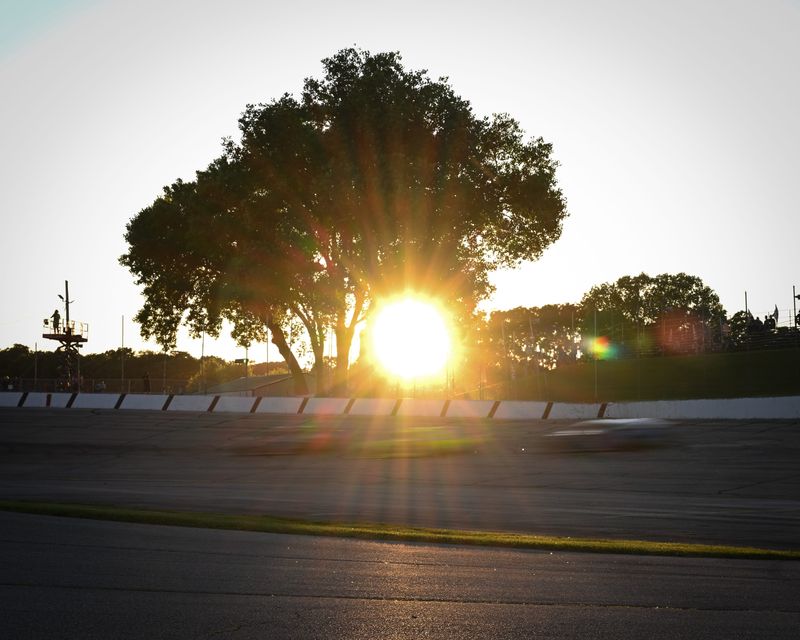The field passes through Turn 1 as the sun begins to set during the ASA STARS National Tour Capital 200 Tuesday, June 23, 2026, at Madison International Speedway in the Town of Rutland, Wisconsin.