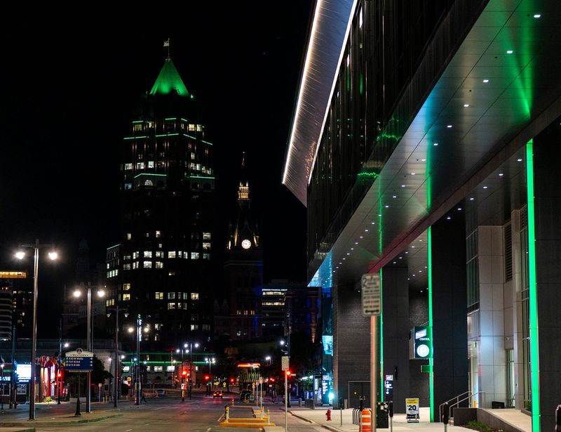 The Associated Bank River Center building and Baird Center along West Kilbourn Avenue in downtown Milwaukee are seen illuminated in green in tribute to Milwaukee Bucks players Giannis Antetokounmpo and Bobby Portis Jr. after they were traded to the Miami Heat.