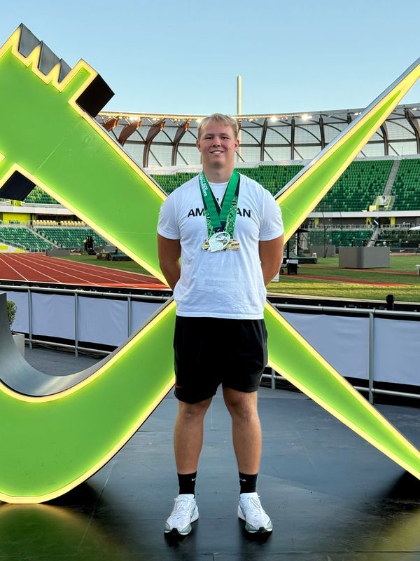 Marathon's Chris Marcell poses in front of meet stage in Oregon (Provided by Chris Marcell.)