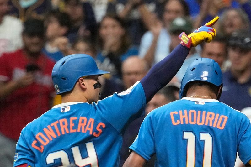 Brewers catcher William Contreras and left fielder Jackson Chourio head back to the dugout after Contreras hit a two-run home run against the Chicago Cubs in the seventh inning on Friday, June 26 at American Family Field.