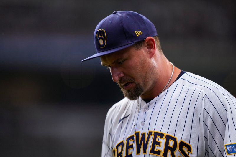 Brewers reliever Joel Kuhnel hangs his head as he walks off the field after surrendering three runs in the top of the 10th inning to the Cubs on Sunday, June 28 at American Family Field.