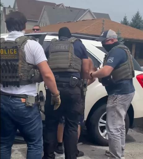 A screenshot of video posted to social media showing Immigration and Customs Enforcement agents arresting someone in Milwaukee on June 28. The Journal Sentinel has not independently verified the details of the arrest.