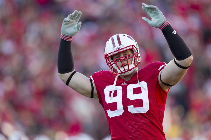 Nov 27, 2010; Madison, WI, USA;  Wisconsin Badgers defensive tackle J.J. Watt (99) fires up the crowd prior to the game against the Northwestern Wildcats at Camp Randall Stadium.  Wisconsin defeated Northwestern 70-23.  Mandatory Credit: Jeff Hanisch-USA TODAY Sports
