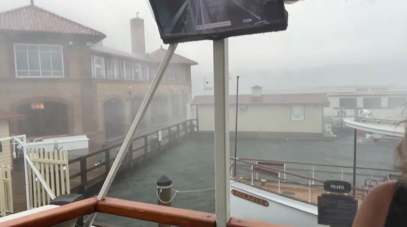 A photo from a video shows a powerful storm sweeping across Lake Geneva, forcing mailboat passengers to rush for safety. The rapidly developing storm created hazardous boating conditions on Geneva Lake, overwhelming a recreational boat carrying 10 people and causing it to capsize and sink. Three children died, according to the Geneva Lake Law Enforcement Agency, while six adults and one child were rescued.