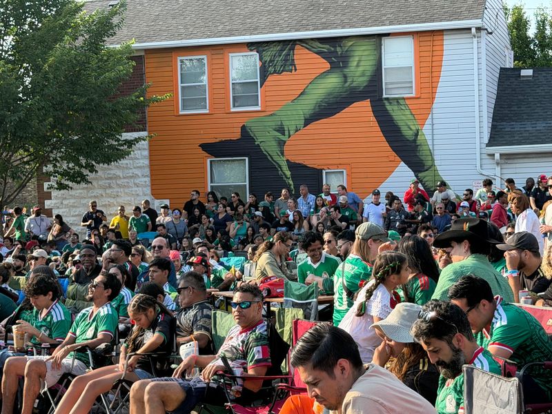 Dominated by Mexico's green jerseys, the crowd at Zócalo Food Park awaits the start of the July 5 match between Mexico and England. The Milwaukee watch party drew a crowd of at least 1,000, including those who didn't fit within the event boundaries.