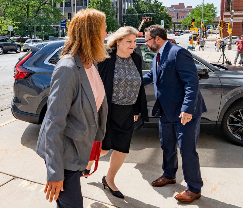 Former Milwaukee County Judge Hannah Dugan, center, enters the Milwaukee Federal Building & U.S. Courthouse before her sentencing in Milwaukee, Wisconsin on July 8, 2026.
