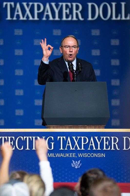 Republican gubernatorial candidate Tom Tiffany forms a zero with his hand as he says "zero fraud" while speaking at an event with Vice President JD Vance at the Wisconsin Air National Guard’s 128th Air Refueling Wing on July 8, 2026 in Milwaukee, Wisconsin.