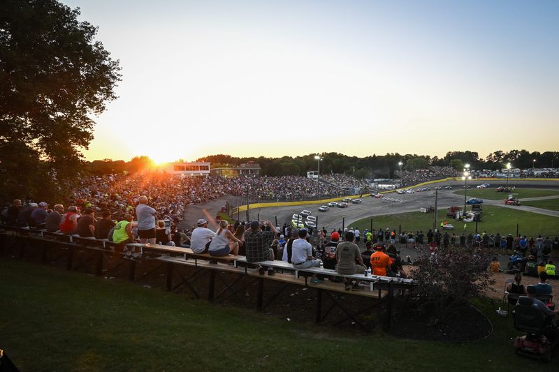 Drivers race in the 47th Slinger Nationals feature as the sun begins to set Tuesday, July 14, 2026, at Slinger Speedway in Slinger, Wisconsin.