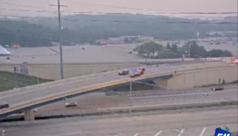 Squad cars block traffic on the Zoo Interchange in Milwaukee, following a motorcycle crash on July 15, 2026.