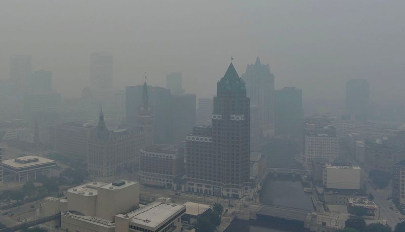 Smoke from wildfires in Canada and northern Minnesota hangs over downtown Milwaukee, Wisconsin, on July 16, 2026.