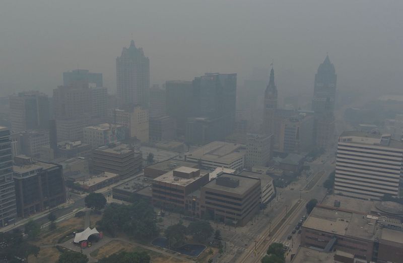 Smoke from wildfires in Canada and northern Minnesota hangs over downtown Milwaukee, Wisconsin, on July 16, 2026.